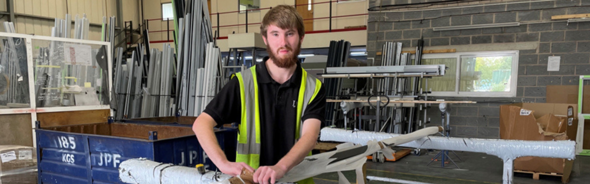 Jamie from the Automatic Door Company working inside workshop