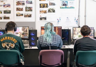 Three Full Time Computing And IT Students Wearing Virtual Reality Headsets