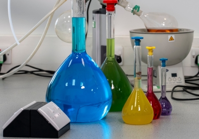 Female Full Time Science Student Wearing Labcoat Standing In A Lab