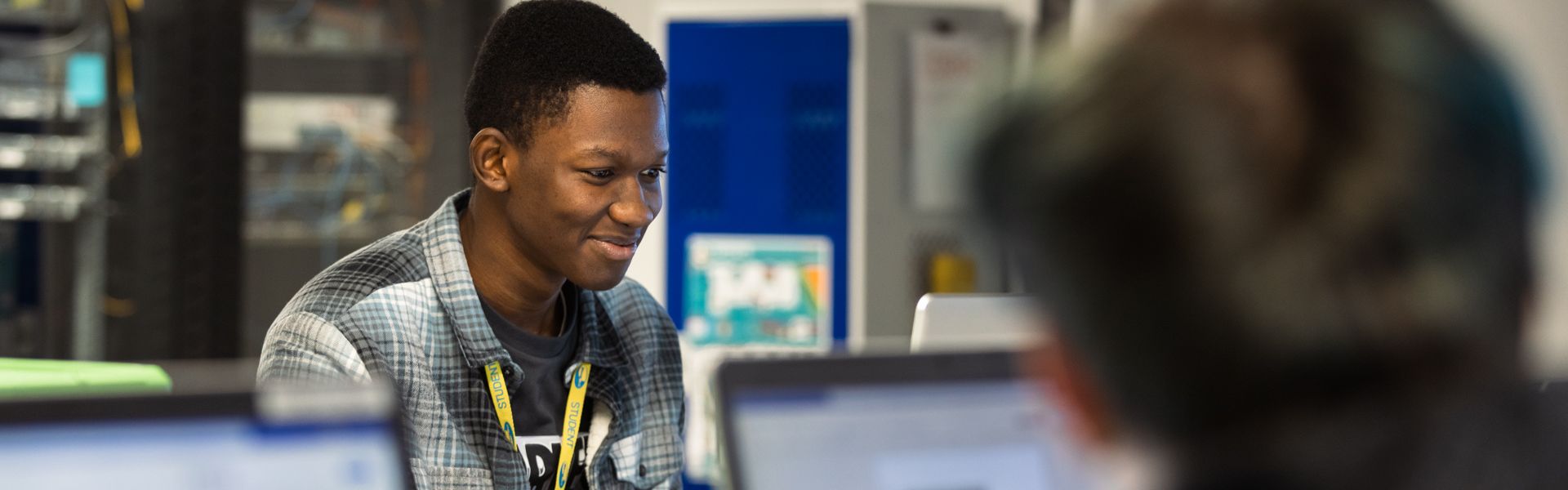 Computing student in class using a laptop